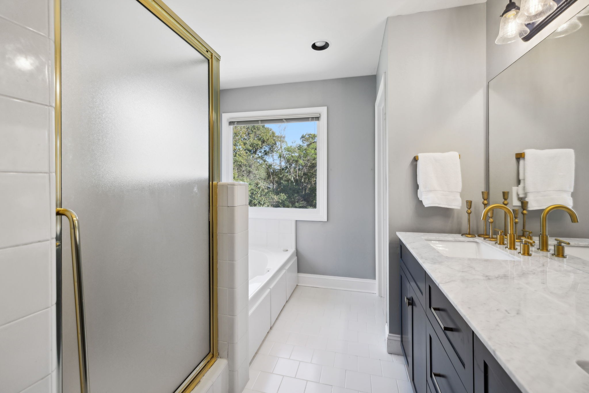 412 Martingale Drive Franklin, TN 37067 - Photo 27 of 56 a bathroom with a granite countertop sink a vanity and mirror