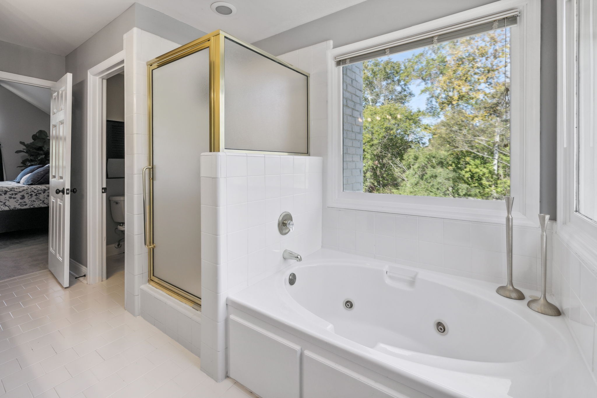 412 Martingale Drive Franklin, TN 37067 - Photo 28 of 56 a bathroom with a bathtub and a shower