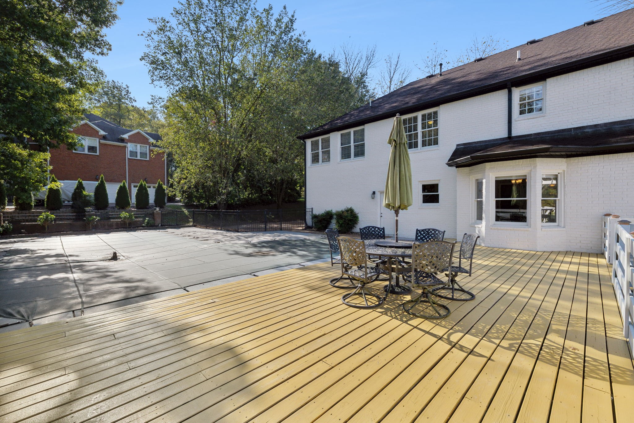 412 Martingale Drive Franklin, TN 37067 - Photo 40 of 56 a view of a patio with table and chairs with wooden floor and fence