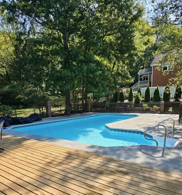 412 Martingale Drive Franklin, TN 37067 - Photo 42 of 56 a view of a swimming pool with lawn chairs and plants