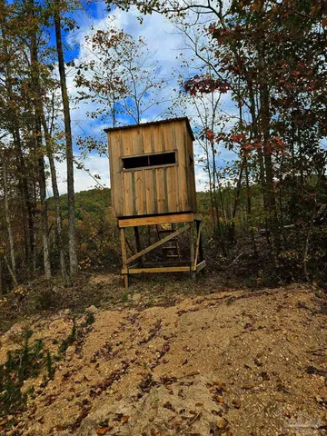 a view of a balcony with wooden floor