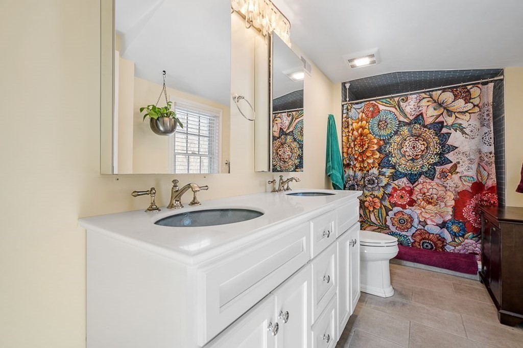 33 Colonial Road Sutton, MA 01590 - Photo 20 of 32 a bathroom with a sink and a mirror