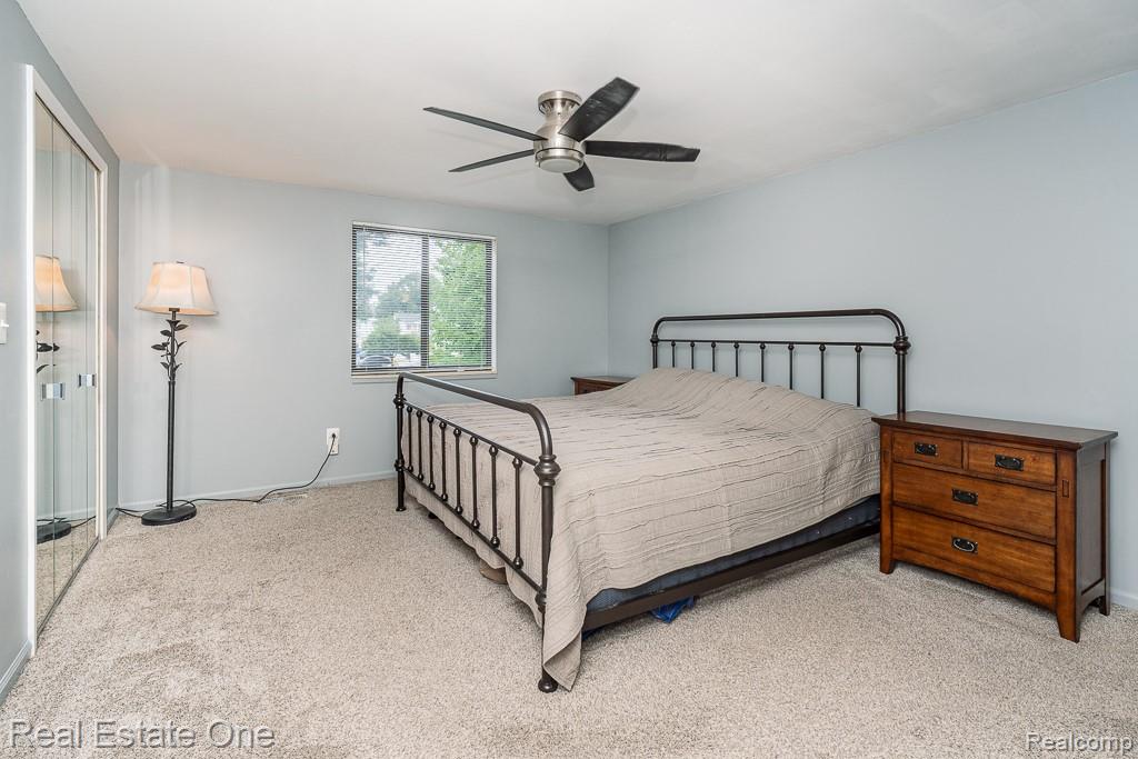 2355 Hillendale Drive Rochester, MI 48309 - Photo 15 of 44 Bedroom featuring light-toned carpeting and a ceiling fan