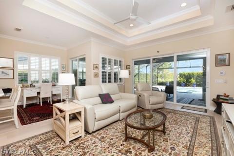 5717 Anegada Drive Naples, FL 34113 - Photo 1 of 37 a living room with furniture and a large window
