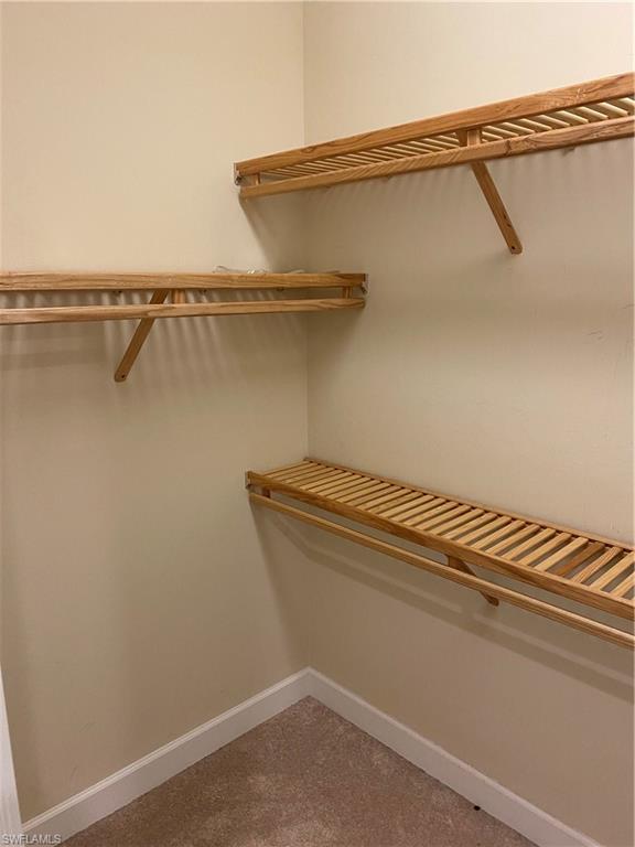 5717 Anegada Drive Naples, FL 34113 - Photo 23 of 37 a view of a room with racks on the wall