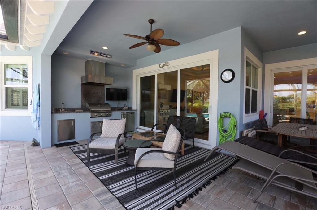 5717 Anegada Drive Naples, FL 34113 - Photo 24 of 37 a living room with patio furniture