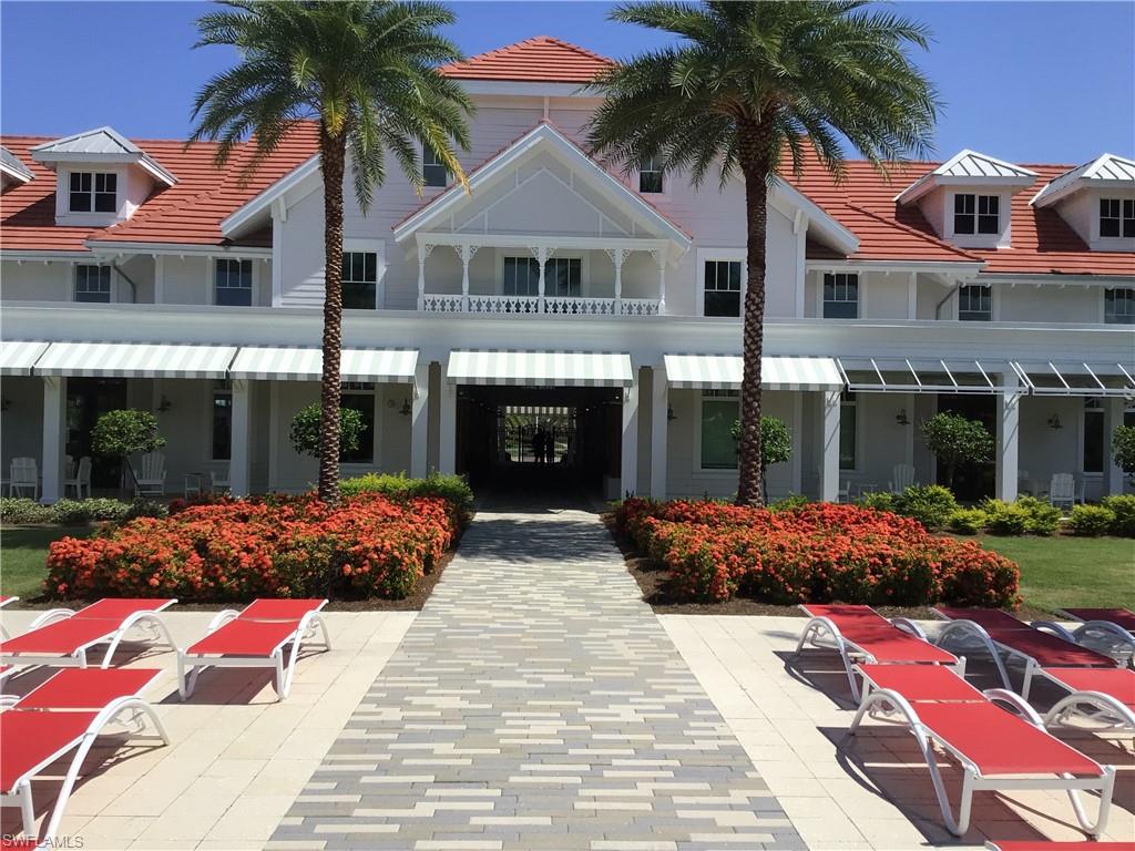 5717 Anegada Drive Naples, FL 34113 - Photo 30 of 37 a front view of a house with garden