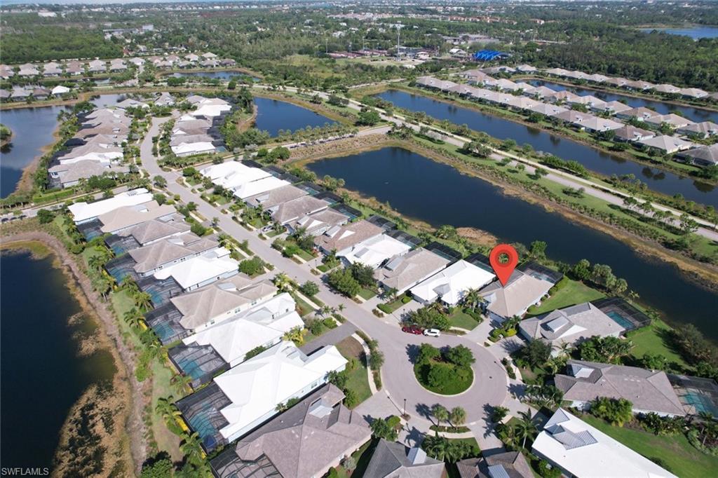 5717 Anegada Drive Naples, FL 34113 - Photo 33 of 37 an aerial view of city parking and river