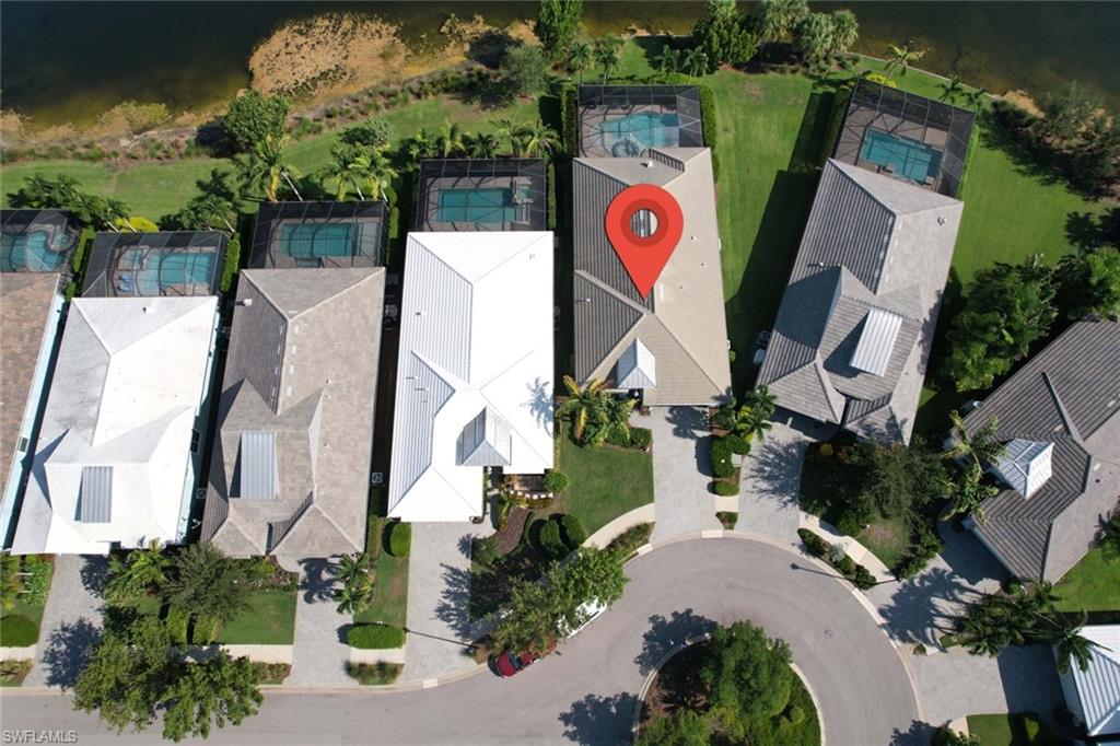5717 Anegada Drive Naples, FL 34113 - Photo 34 of 37 an aerial view of residential house with sign board and yard