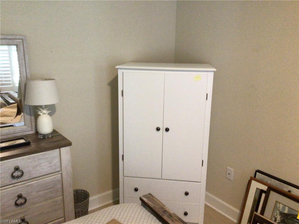 5717 Anegada Drive Naples, FL 34113 - Photo 8 of 37 a view of a hallway with closet