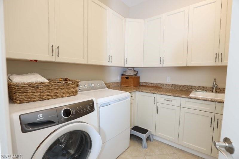 5717 Anegada Drive Naples, FL 34113 - Photo 10 of 37 a utility room with sink dryer and washer