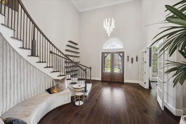 a view of entryway with wooden floor and stairs