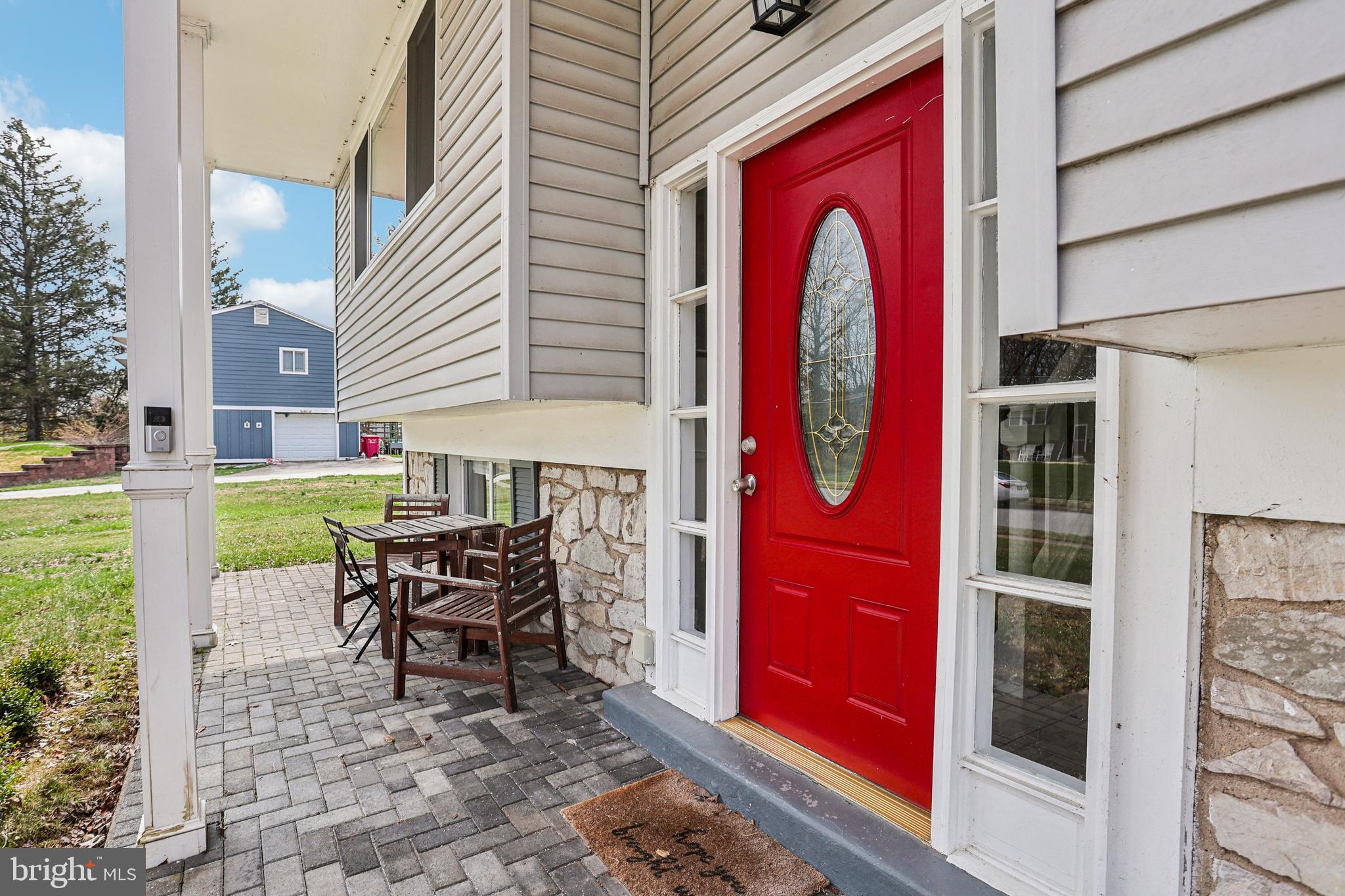 15 Brimfield Road Audubon, PA 19403 - Photo 4 of 41 a patio with a table and chairs