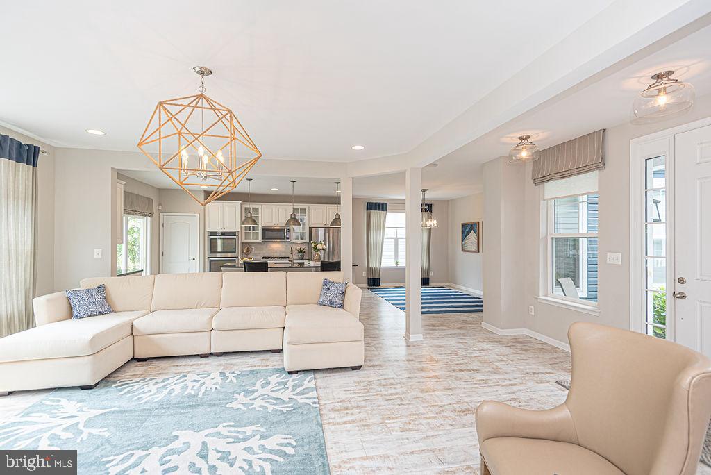 30134 Islander Beach Road Frankford, DE 19945 - Photo 11 of 73 a living room with furniture and a large window