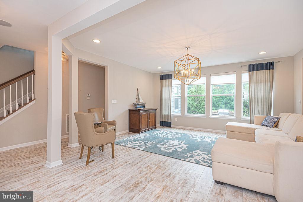 30134 Islander Beach Road Frankford, DE 19945 - Photo 12 of 73 a living room with furniture and a large window