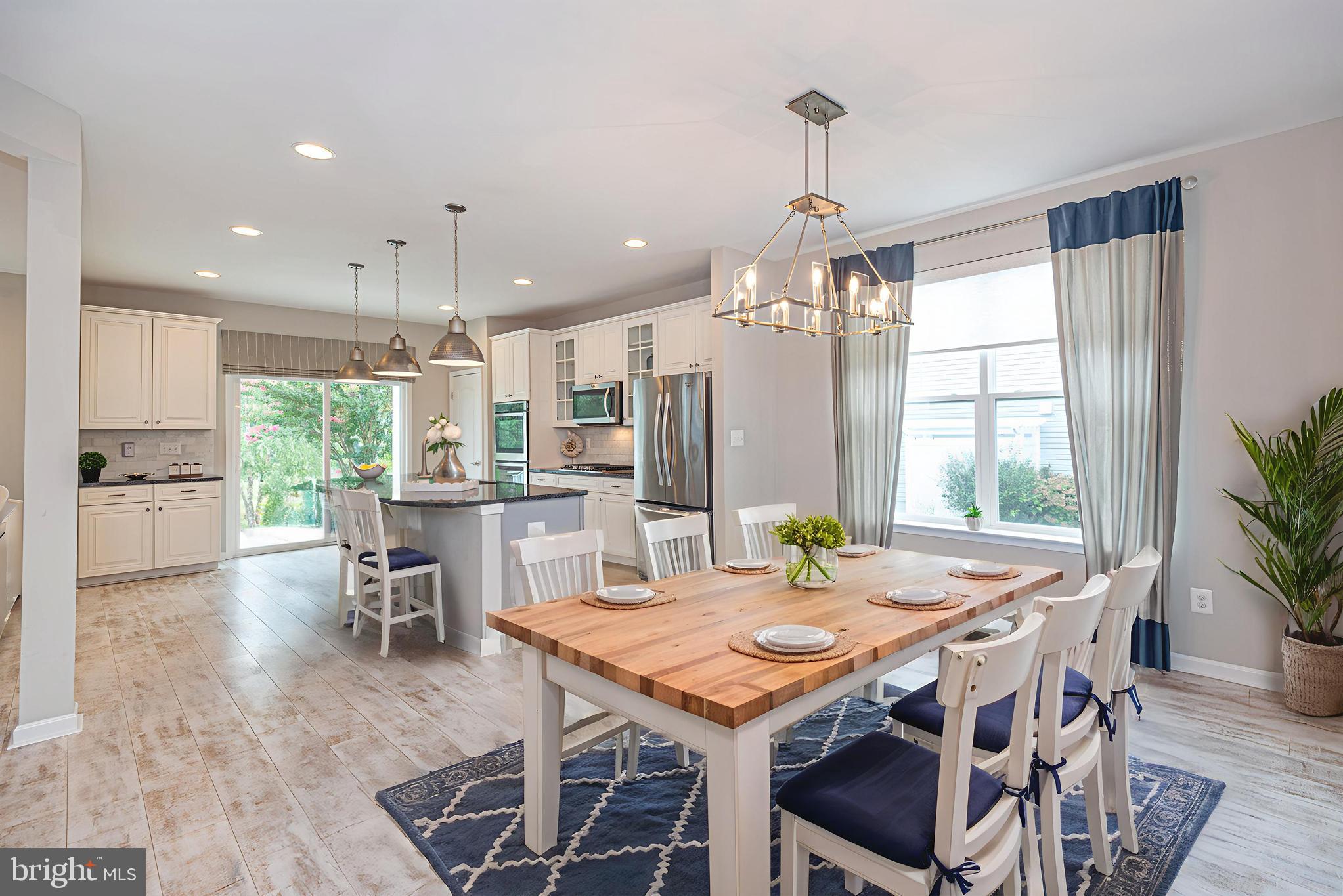 30134 Islander Beach Road Frankford, DE 19945 - Photo 14 of 73 a view of a dining room with furniture window and outside view