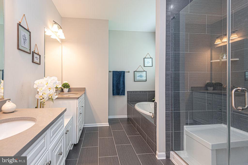 30134 Islander Beach Road Frankford, DE 19945 - Photo 20 of 73 a bathroom with a sink a toilet and shower