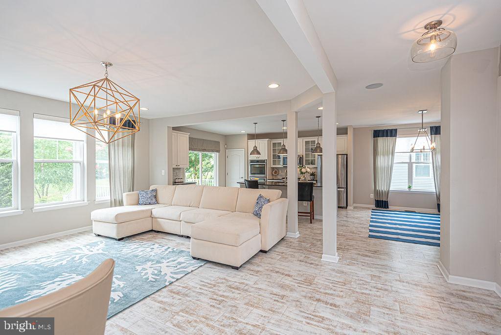 30134 Islander Beach Road Frankford, DE 19945 - Photo 26 of 73 a living room with furniture and large windows