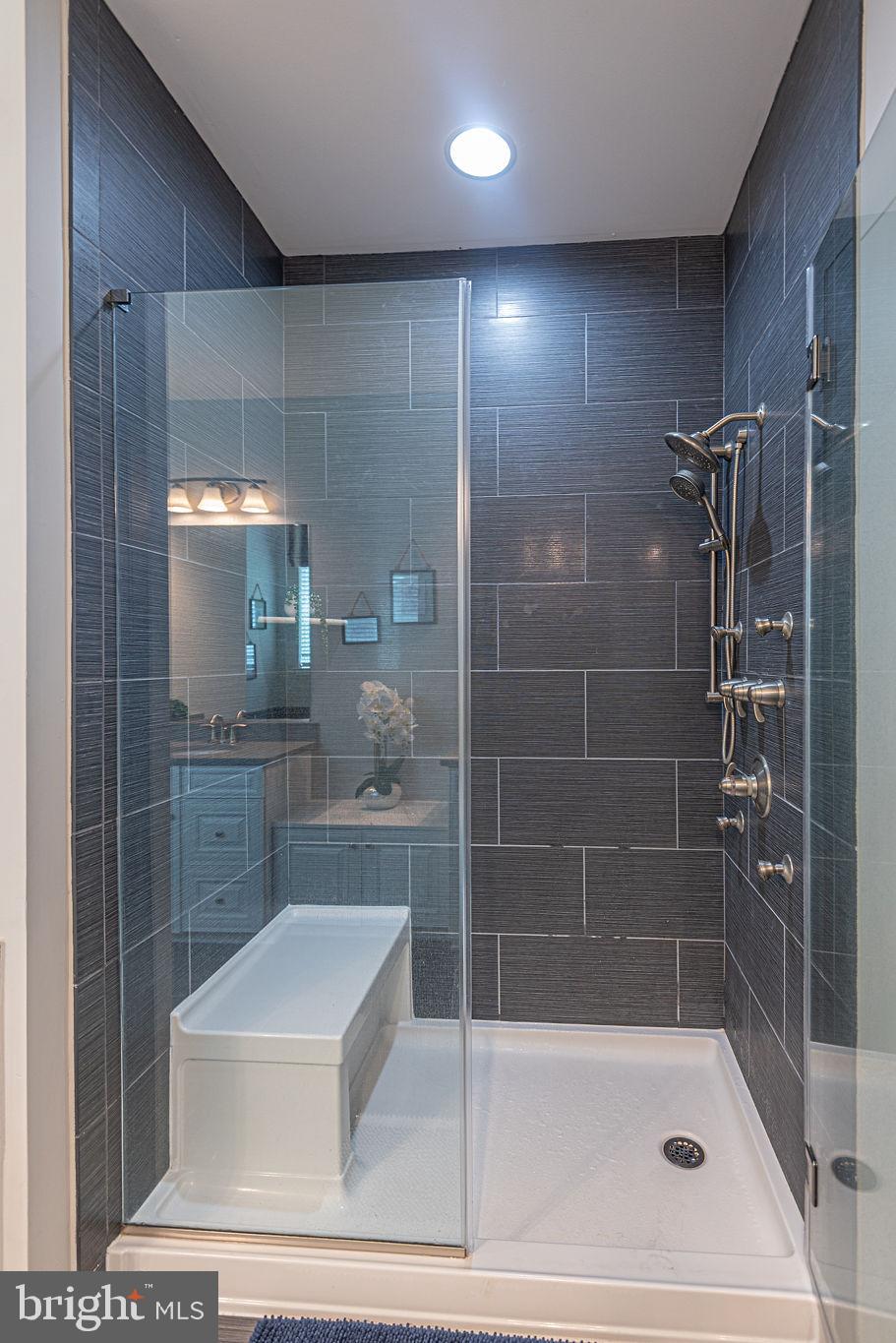 30134 Islander Beach Road Frankford, DE 19945 - Photo 33 of 73 a bathroom with a shower a toilet and sink