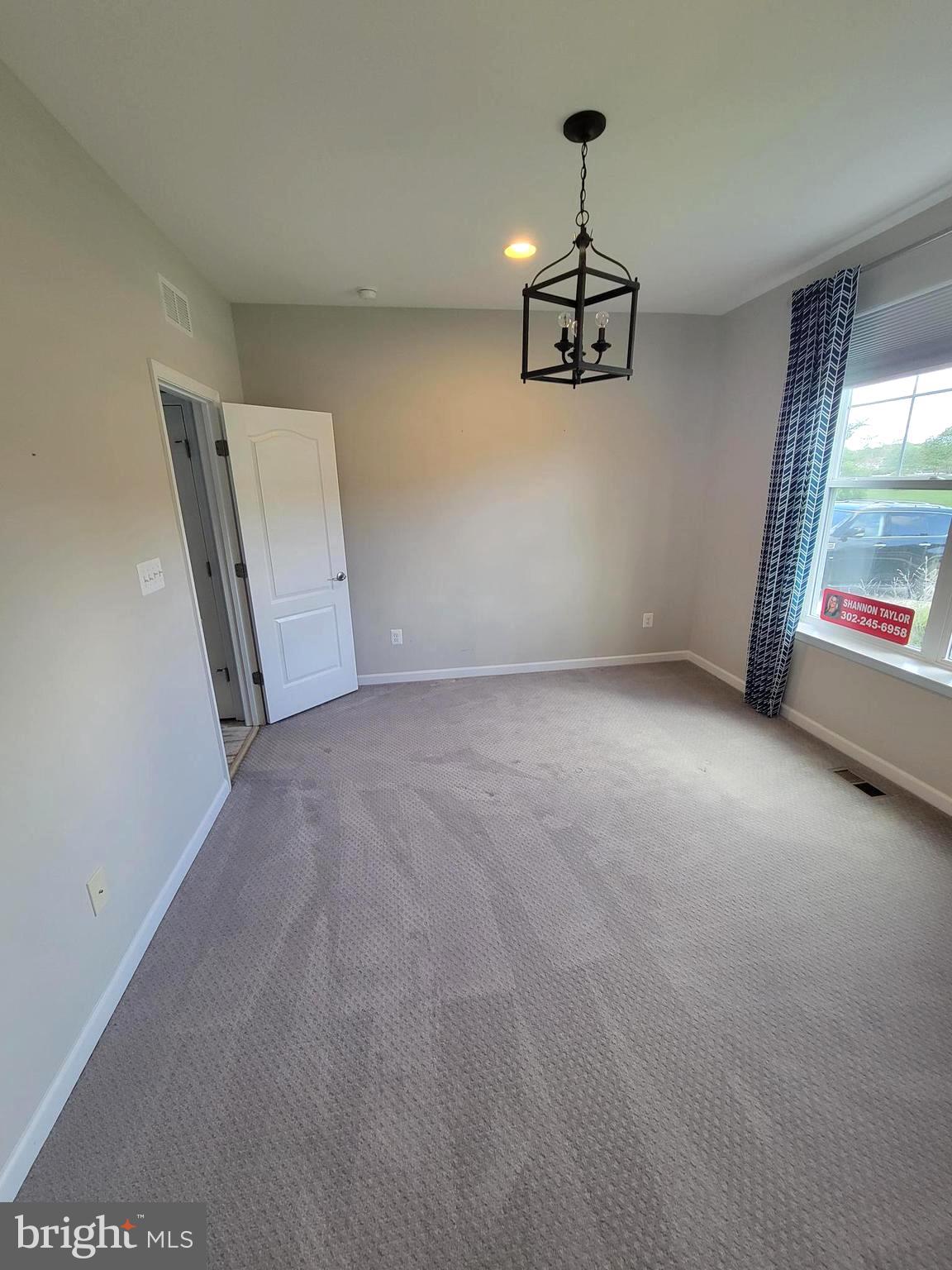 30134 Islander Beach Road Frankford, DE 19945 - Photo 41 of 73 an empty room with windows and cabinet