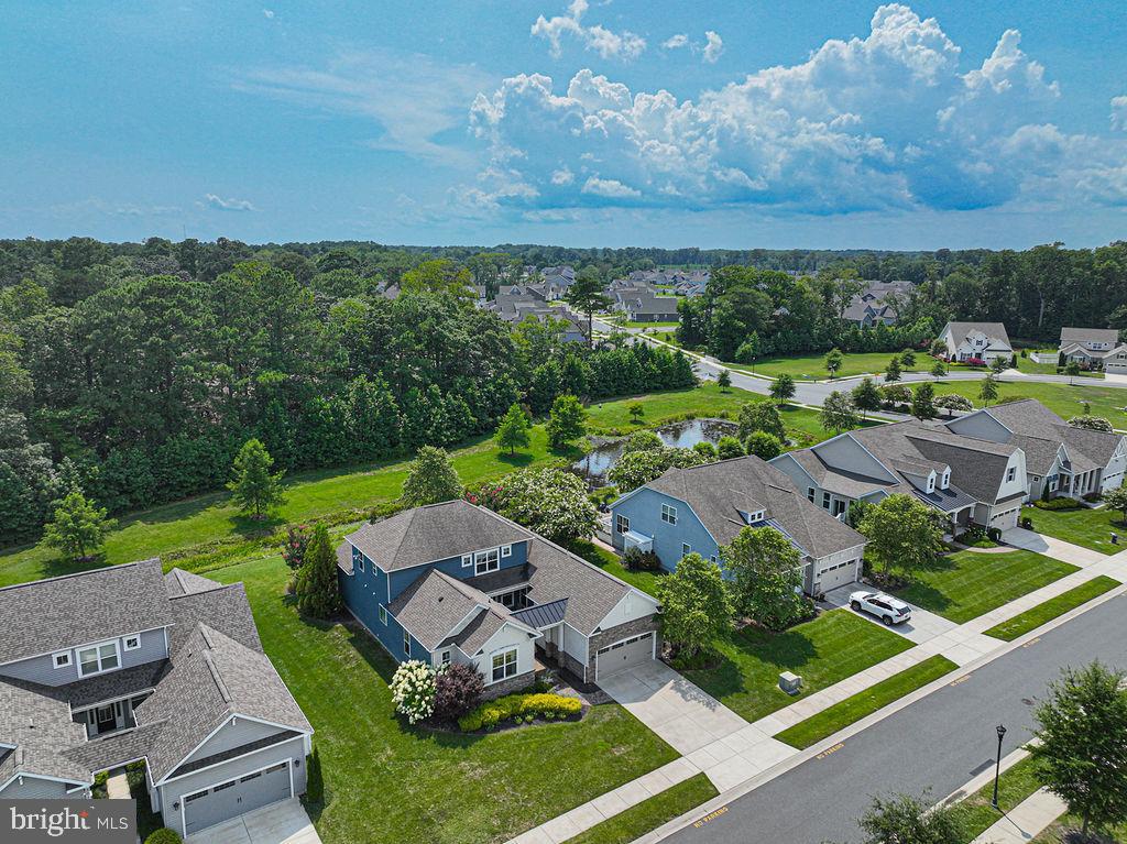 30134 Islander Beach Road Frankford, DE 19945 - Photo 65 of 73 an aerial view of a house with garden space and street view