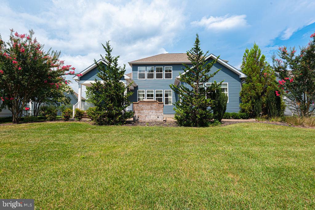 30134 Islander Beach Road Frankford, DE 19945 - Photo 70 of 73 a front view of a house with garden