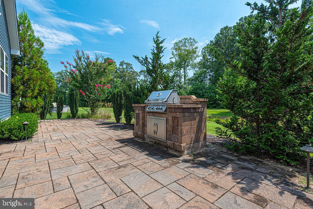 30134 Islander Beach Road Frankford, DE 19945 - Photo 9 of 73 a view of a pathway with a garden