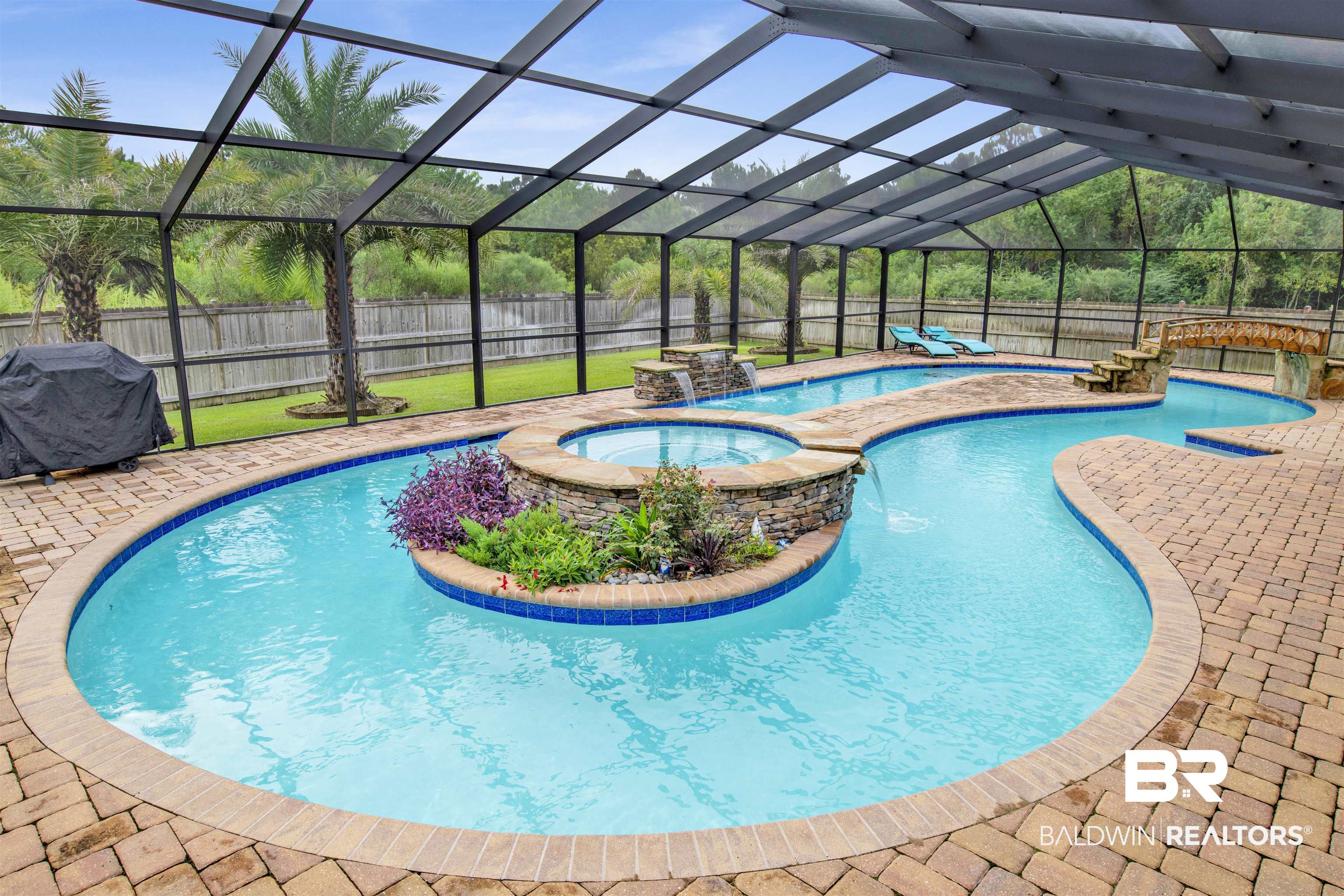 4196 Inverness Circle Gulf Shores, AL 36542 - Photo 30 of 43 View of pool with glass enclosure, pool water feature, an in ground hot tub, area for grilling, and a patio
