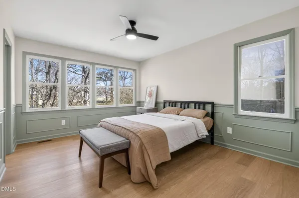 a bedroom with a large bed and a window