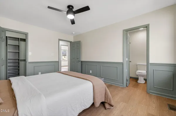a bedroom with a bed and a view of bathroom