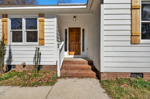 a front view of a house with a garage