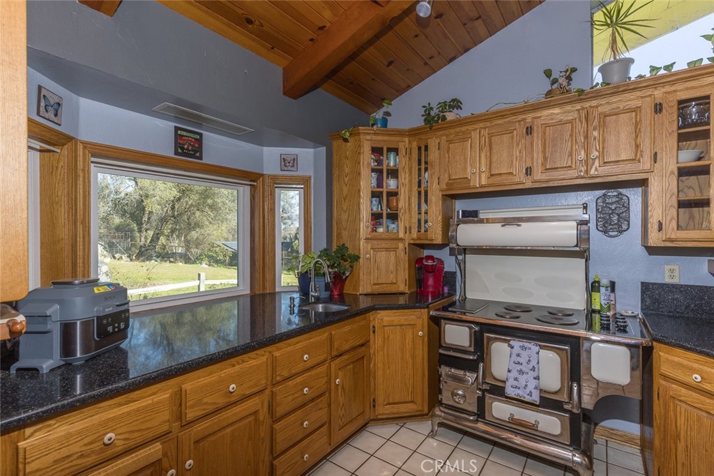 3977 Spring Court Mariposa, CA 95338 - Photo 17 of 72 a open kitchen with stainless steel appliances granite countertop a stove and cabinets