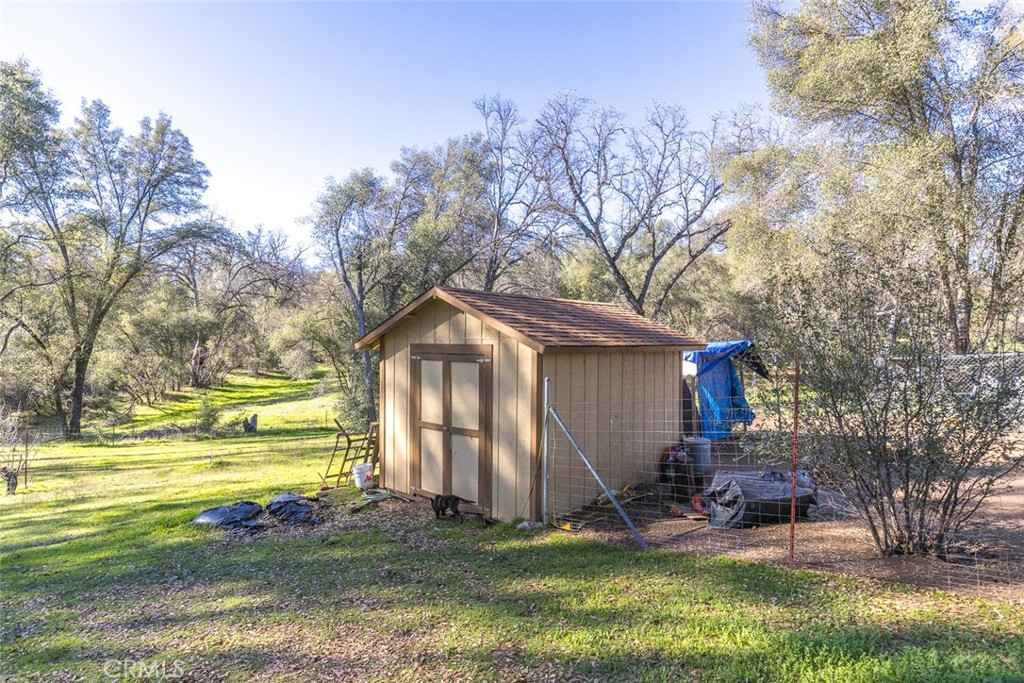 3977 Spring Court Mariposa, CA 95338 - Photo 25 of 72 a view of a house with a big yard and large trees