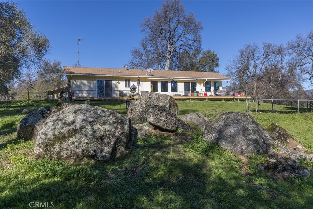 3977 Spring Court Mariposa, CA 95338 - Photo 54 of 72 a view of a big house with a big yard and large trees