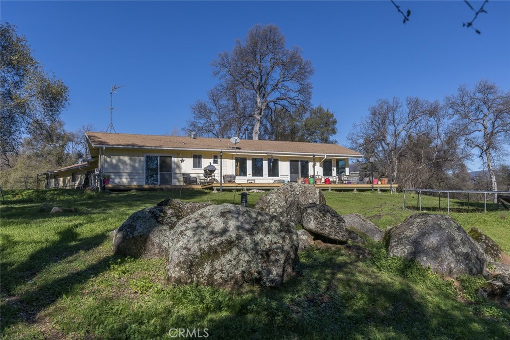 3977 Spring Court Mariposa, CA 95338 - Photo 55 of 72 a front view of a house with a garden
