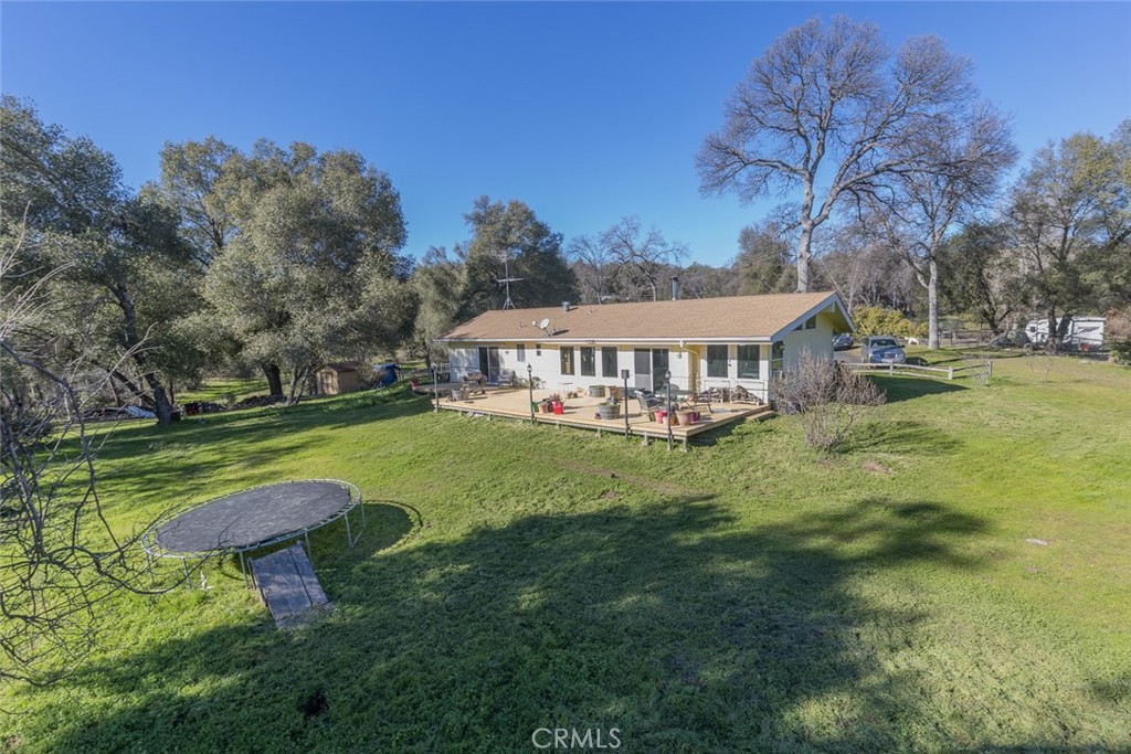 3977 Spring Court Mariposa, CA 95338 - Photo 57 of 72 a view of a house with a yard table and chairs