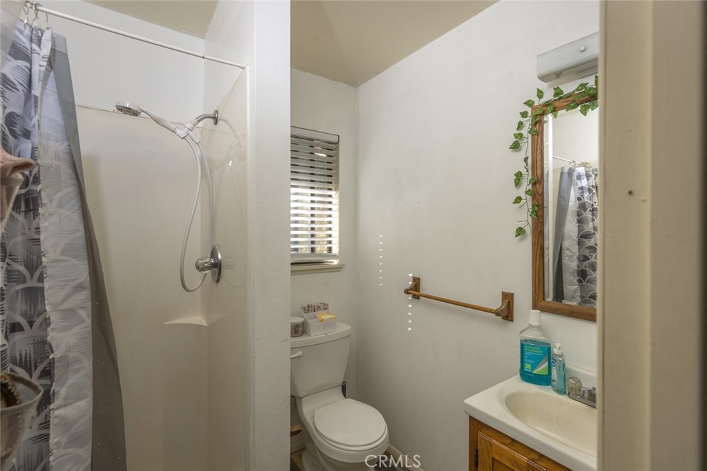 3977 Spring Court Mariposa, CA 95338 - Photo 61 of 72 a bathroom with a toilet and a shower