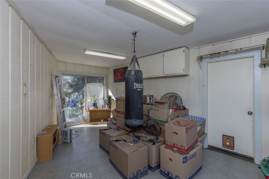 3977 Spring Court Mariposa, CA 95338 - Photo 63 of 72 a living room with furniture a window and gym equipment