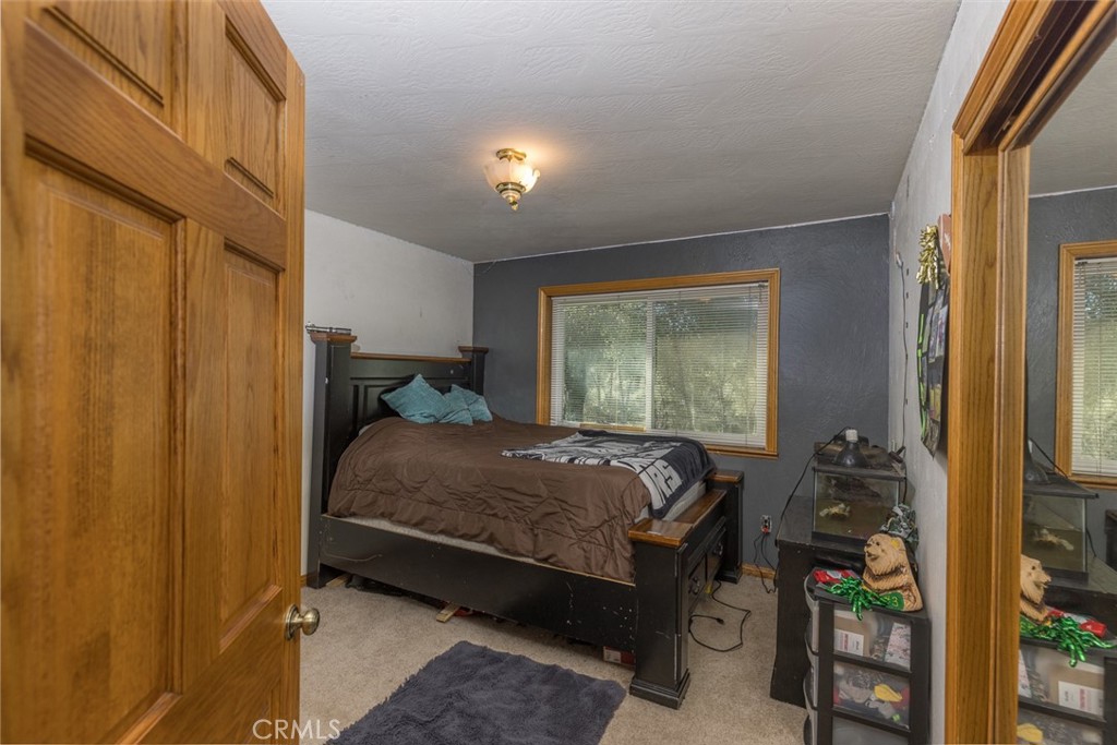 3977 Spring Court Mariposa, CA 95338 - Photo 66 of 72 a bed sitting in a room next to a window