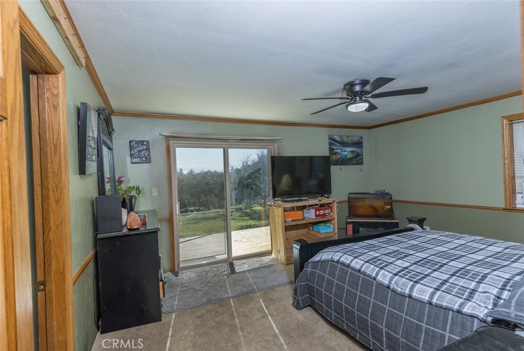 3977 Spring Court Mariposa, CA 95338 - Photo 70 of 72 a bedroom with a bed and a flat screen tv