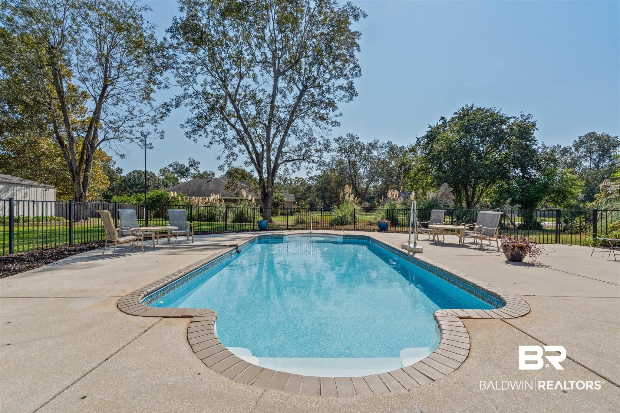 6175 South Grand Bay Wilmer Road Grand Bay, AL 36541 - Photo 22 of 42 View of swimming pool featuring a patio