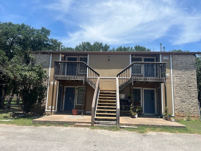 501 Hedgewood Drive, Unit C Georgetown, TX 78628 - Photo 1 of 17 a front view of a house with a garden