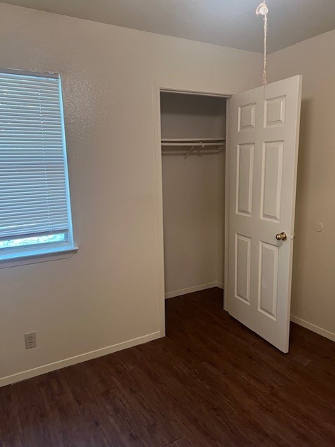 501 Hedgewood Drive, Unit C Georgetown, TX 78628 - Photo 11 of 17 an empty room with wooden floor closet and windows