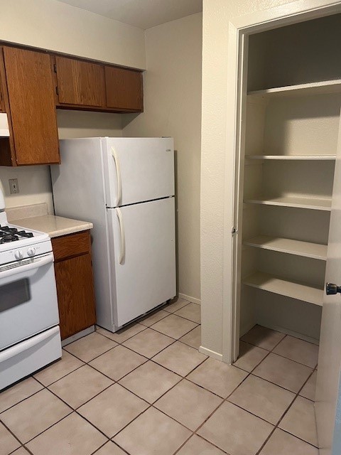501 Hedgewood Drive, Unit C Georgetown, TX 78628 - Photo 5 of 17 a white refrigerator freezer and a stove sitting inside of a kitchen