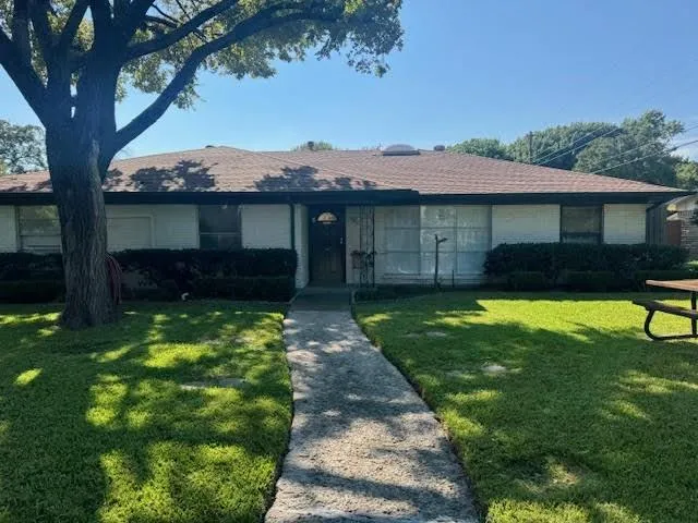 a house view with a garden space