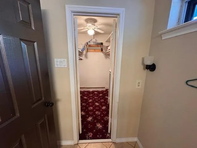 a bedroom with bed and window