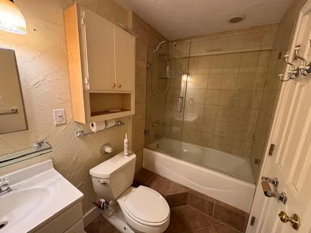 a view of a hallway with a room