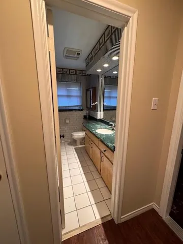 a view of entryway with wooden floor and stairs