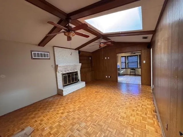 a view of an empty room with a fireplace