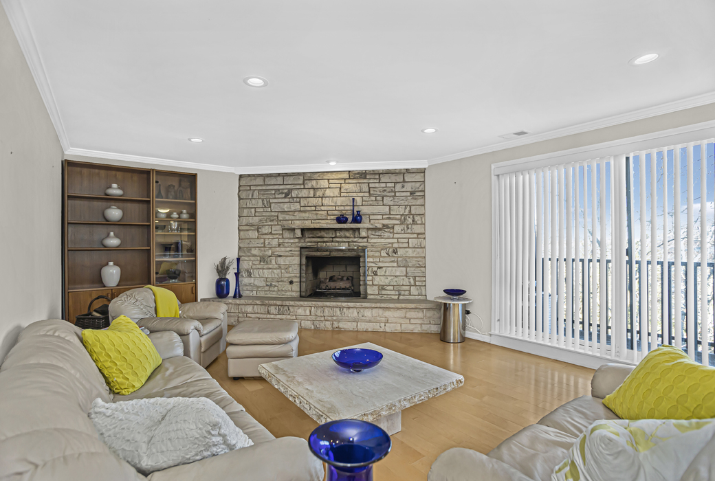 1125 Lake Cook Road, Unit 511 Northbrook, IL 60062 - Photo 10 of 18 a living room with fireplace furniture and a wooden floor